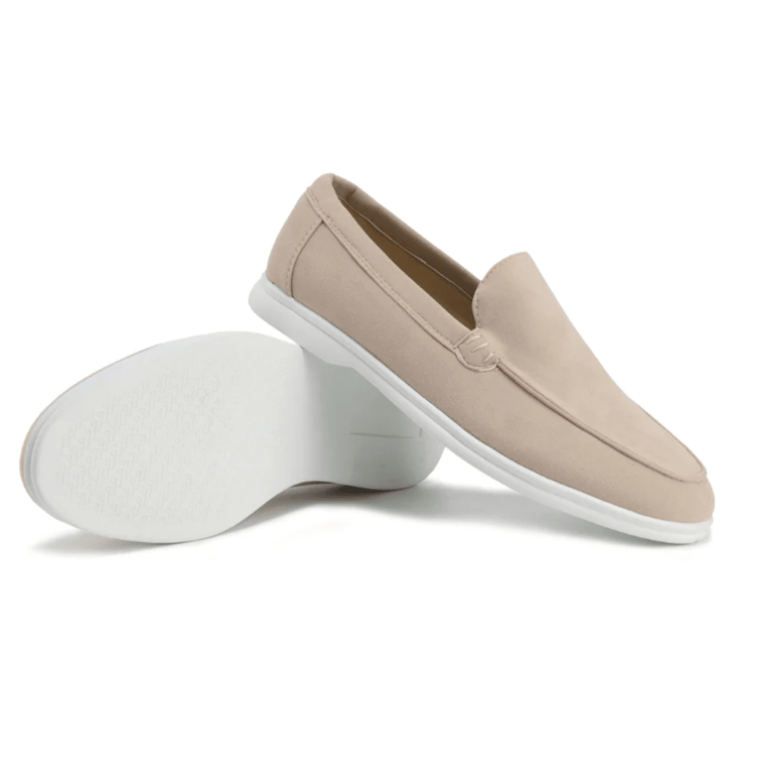 Beige slip-on shoes with white soles on a white background