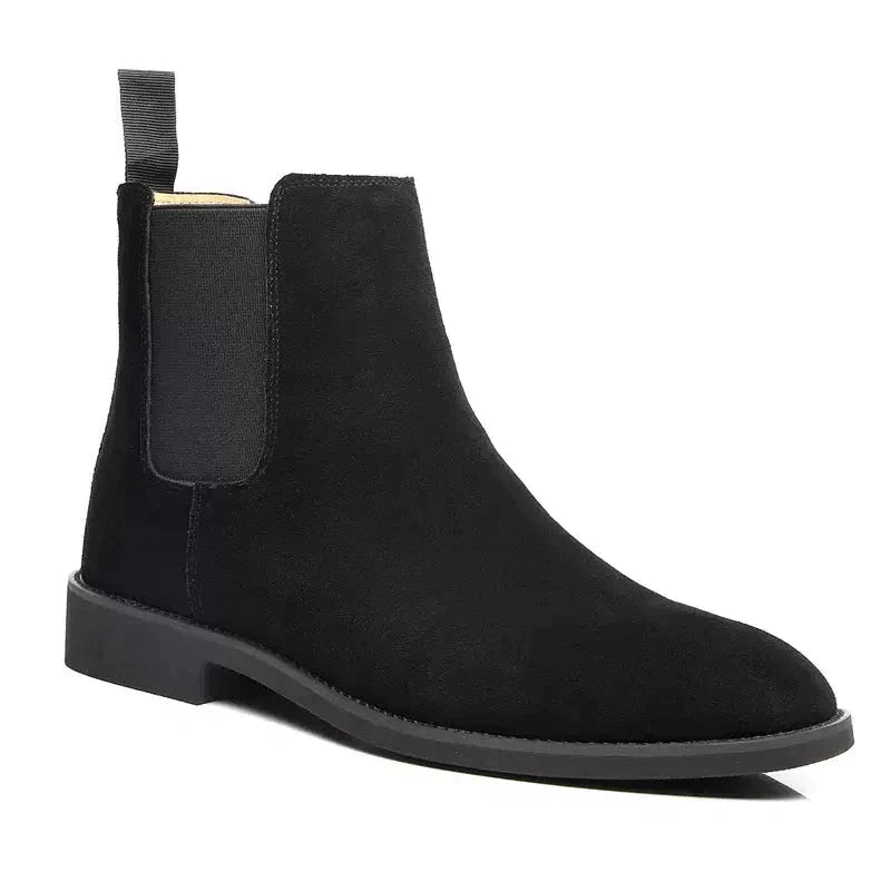 Sophisticated black suede Chelsea boots with a streamlined pointed toe, perfect for a coordinated Old Money aesthetic.