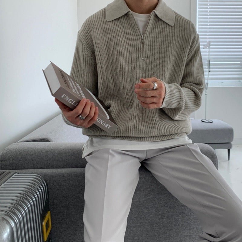 Sophisticated gray loose-fit zip polo for men, showcasing a relaxed silhouette and premium textured finish for a comfortable and cool look.