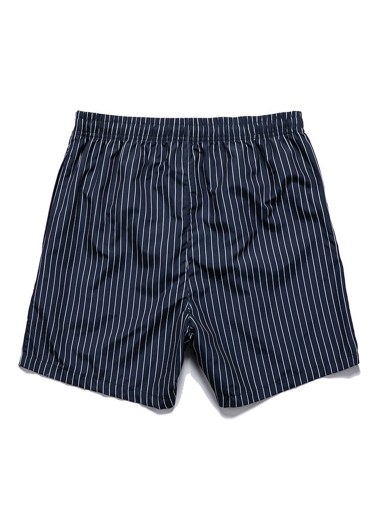 Navy pinstripe shorts on a white background
