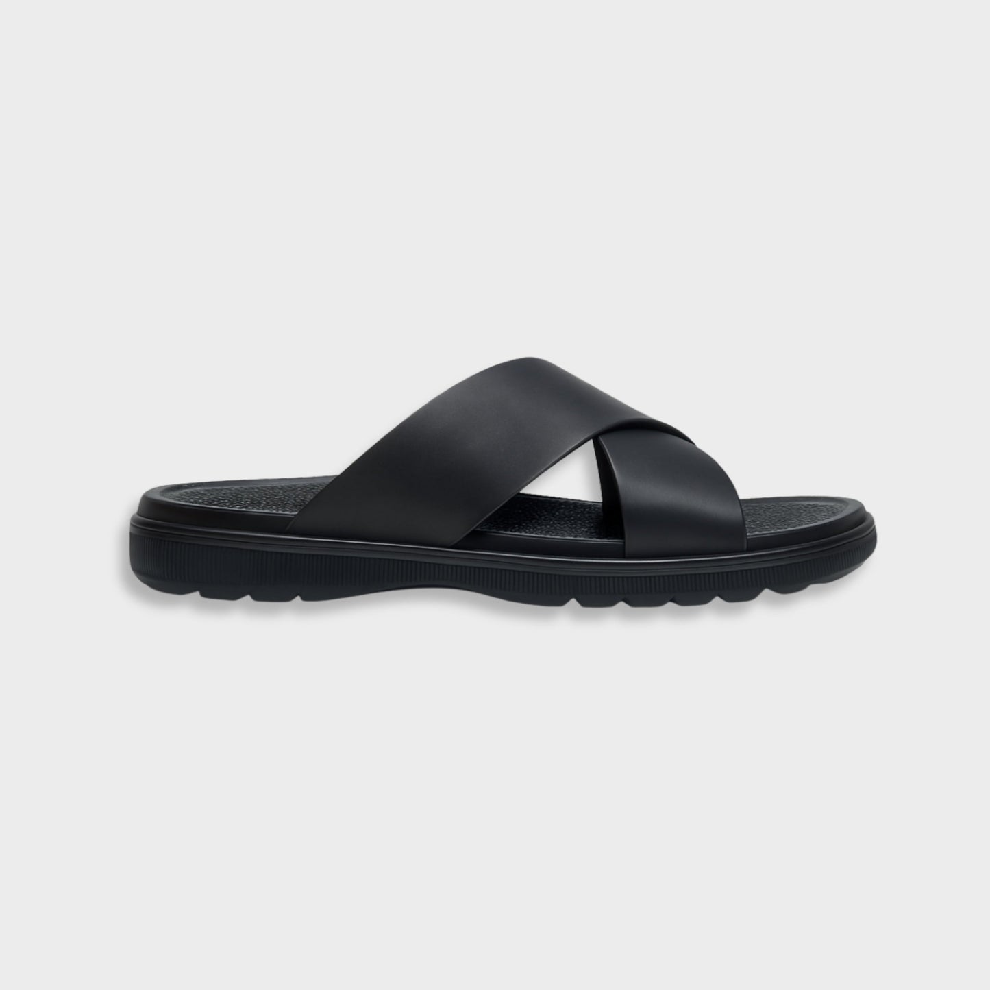 Classic black luxury EVA cross sandal for men, showing the modern silhouette and flexible flat sole.
