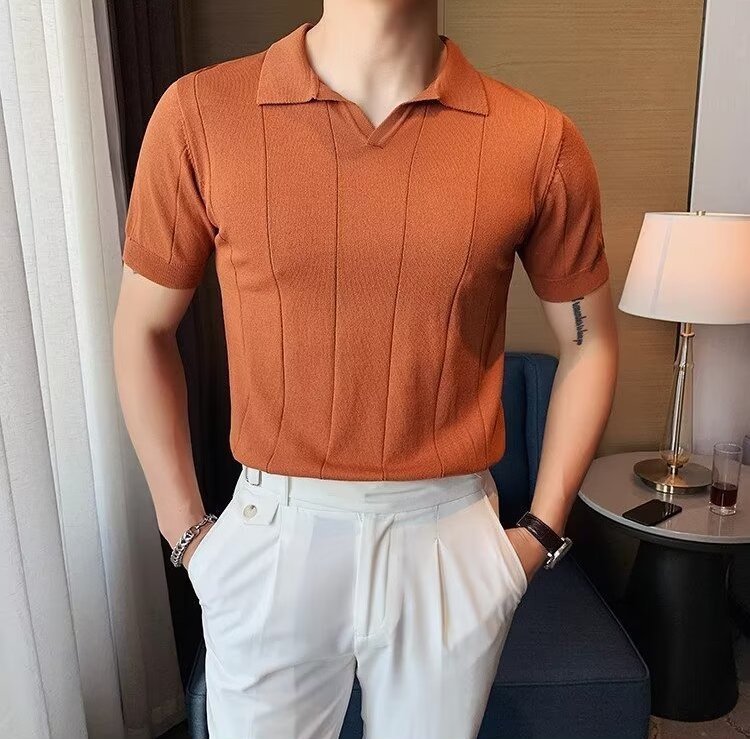 Men's burnt orange knitted polo featuring a sophisticated vertical ribbed texture and a clean, buttonless V-neckline.