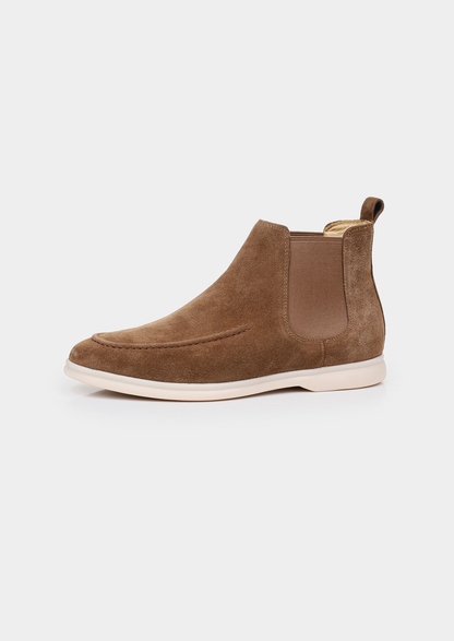 Pair of men brown sheepskin suede Chelsea boots with elastic side panels and off-white sole