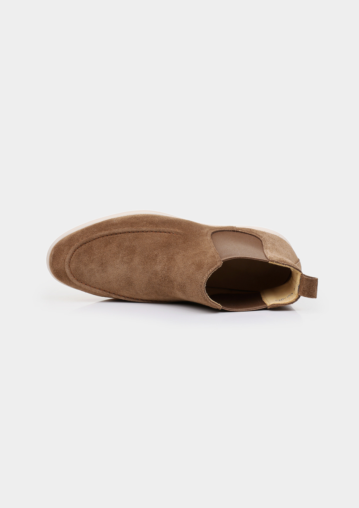 Pair of men brown sheepskin suede Chelsea boots with elastic side panels and off-white sole