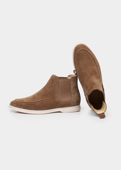 Pair of men brown sheepskin suede Chelsea boots with elastic side panels and off-white sole