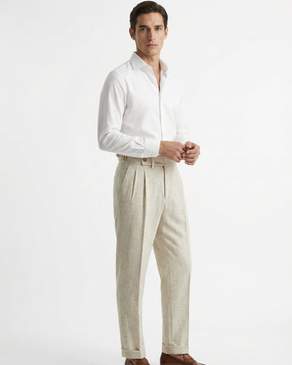 Men wearing LORMIER off-white linen blend pleated trousers with white dress shirt and loafers