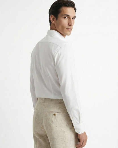 Men wearing LORMIER off-white linen blend pleated trousers with white dress shirt and loafers