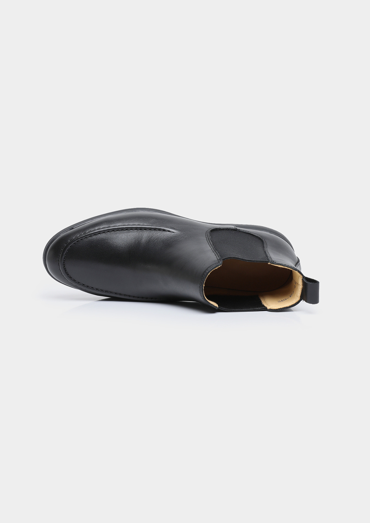 Pair of men smooth black leather Chelsea boots with moccasin apron toe stitching and black rubber sole