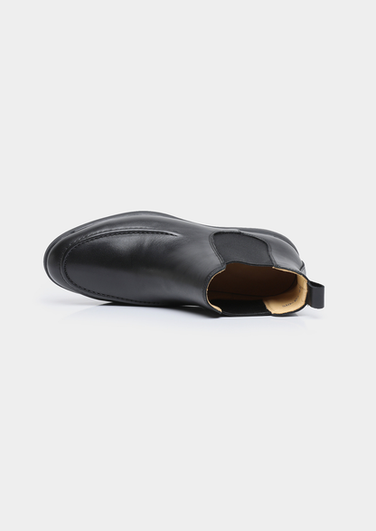 Pair of men smooth black leather Chelsea boots with moccasin apron toe stitching and black rubber sole