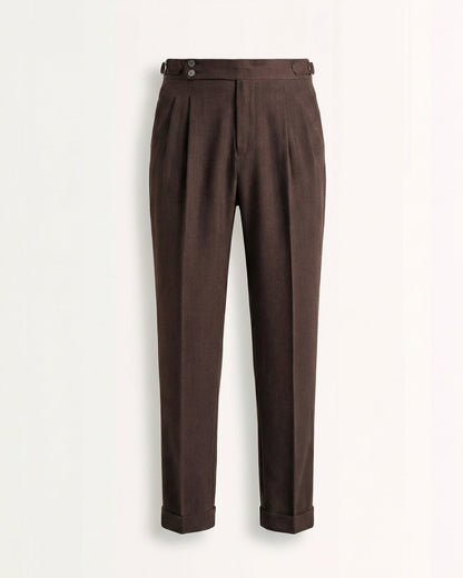 Tailored brown double pleated high waisted trousers with side adjusters and cuffed hem front view