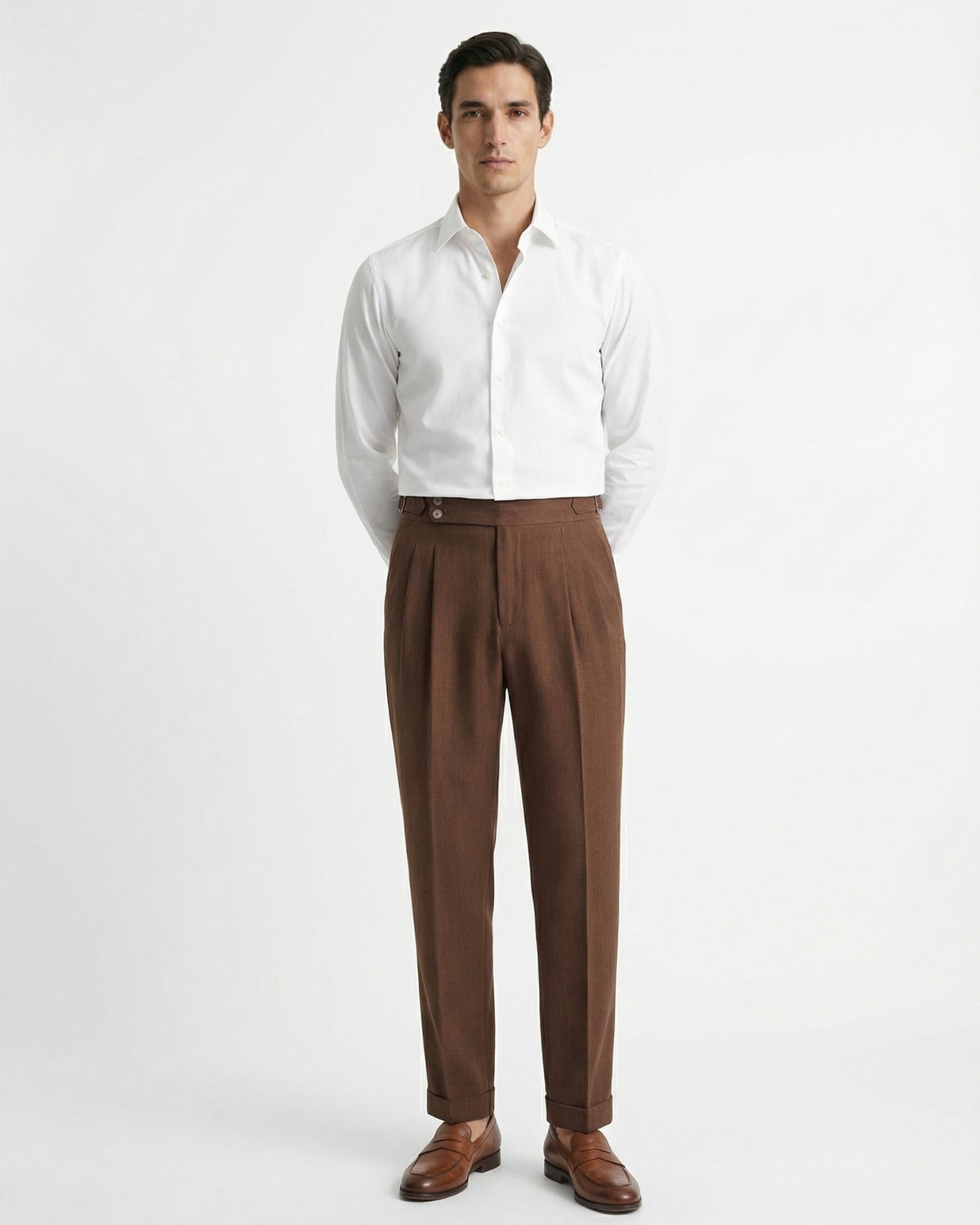 Men's tailored brown double pleated high waisted trousers with side adjusters and cuffed hem front view