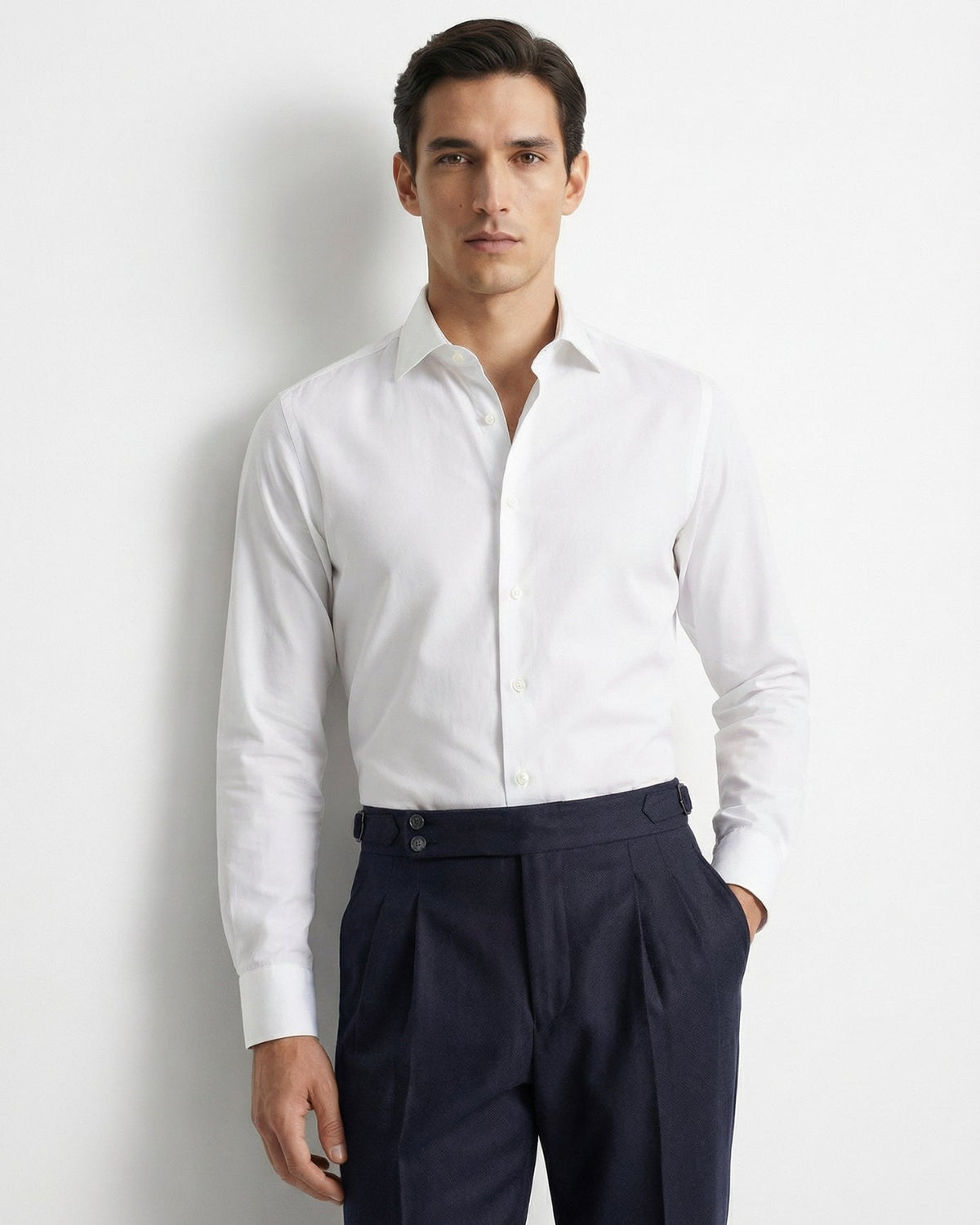Men's tailored navy blue double pleated high waisted trousers with side adjusters and cuffed hem front view