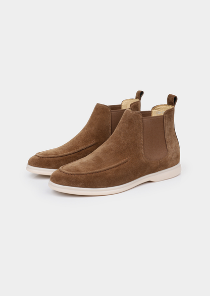 Pair of men brown sheepskin suede Chelsea boots with elastic side panels and off-white sole