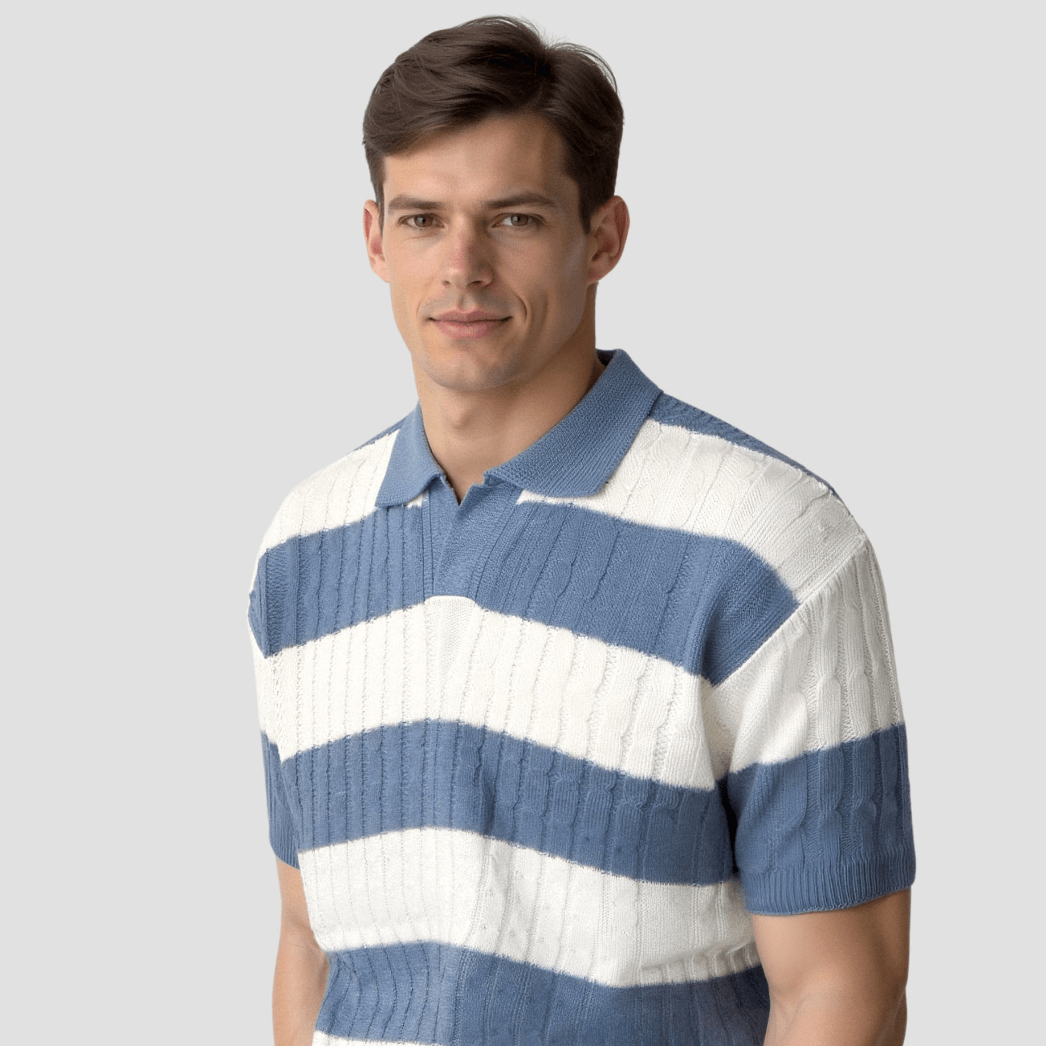 Man wearing a blue and white striped sweater against a plain background