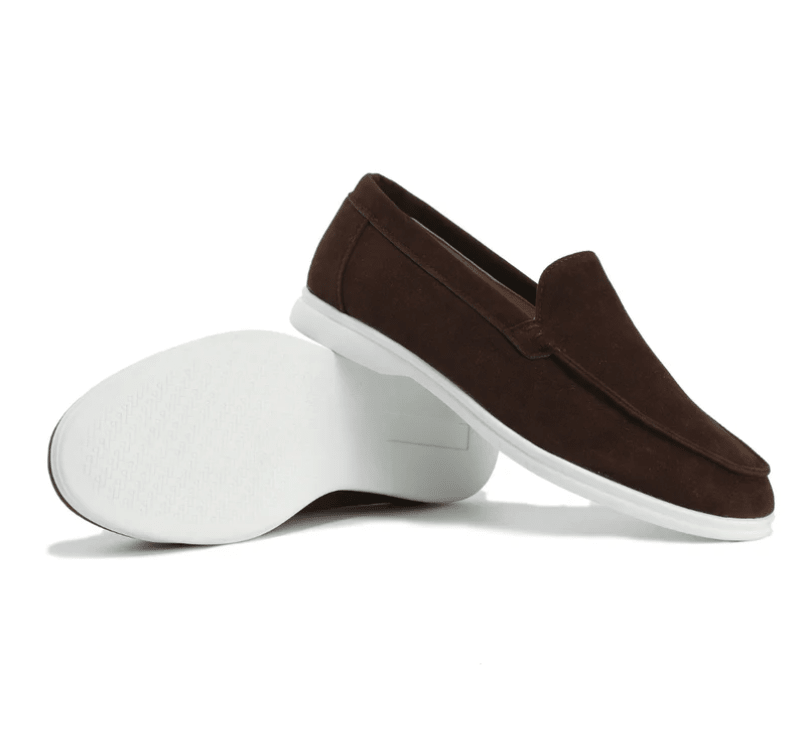 Brown loafers with white soles on a white background