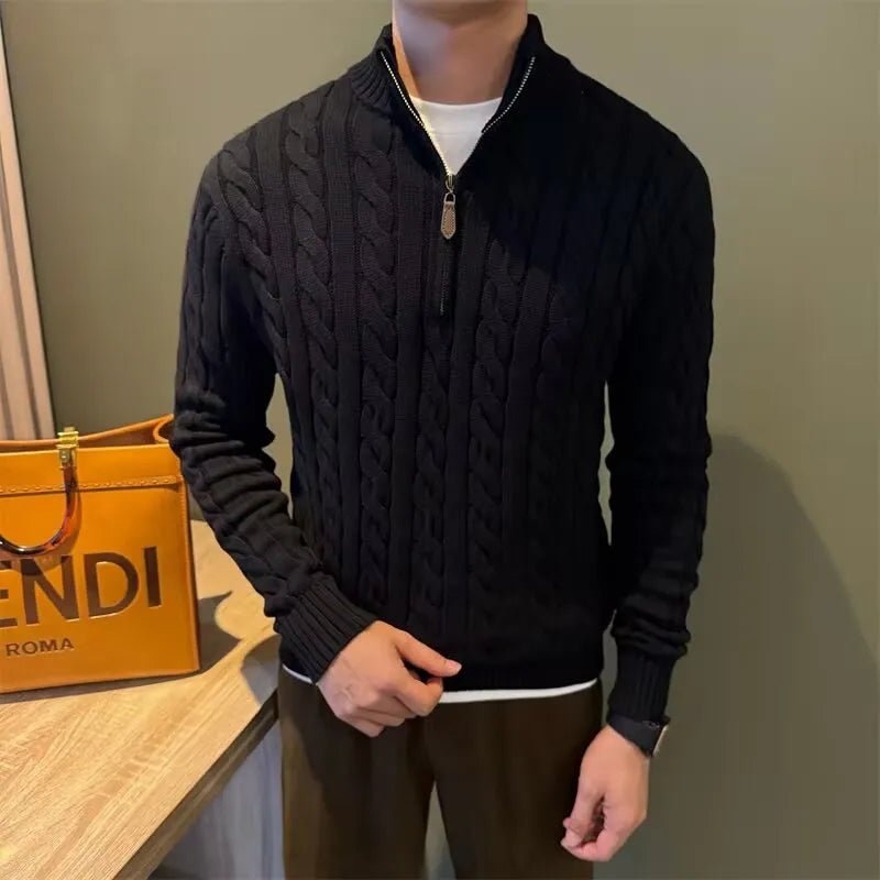 Sophisticated black cotton cable-knit quarter-zip with a signature leather detail pull, providing a sharp and comfortable cool profile.