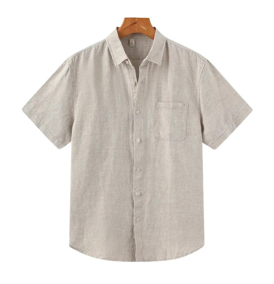 Men's beige short sleeve linen shirt featuring a natural slub texture, chest pocket, and a relaxed tailored fit.