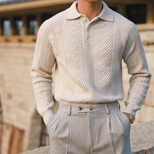 Men's ivory chevron cable knit polo pullover featuring an intricate textured design and three-button collar.