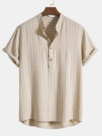 Beige striped shirt on a hanger against a white background