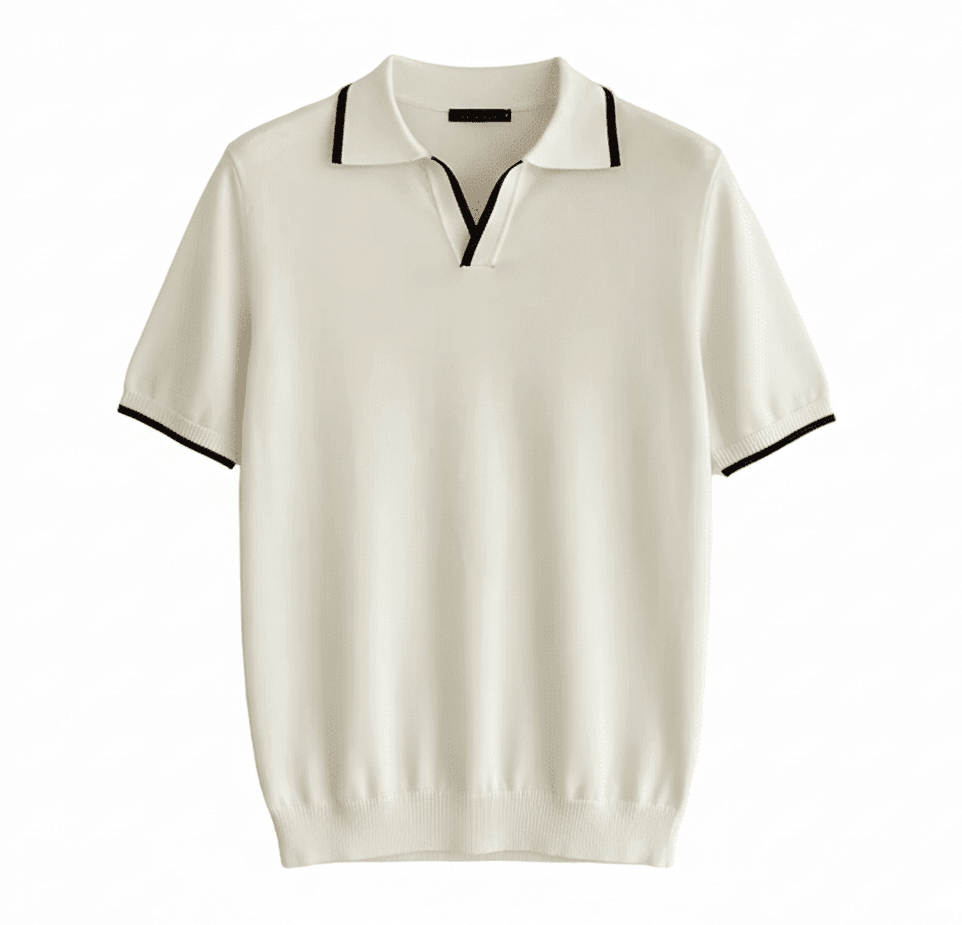 Men's white knit V-neck polo with black contrast tipping on the collar and sleeves, styled for a refined summer look.