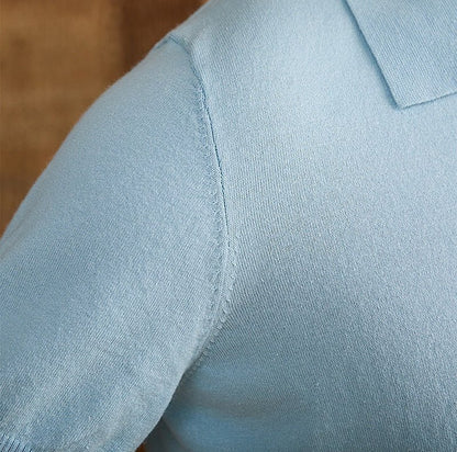 Men's light blue knit polo crafted from a breathable cotton-linen blend, featuring a classic button placket and ribbed hem.
