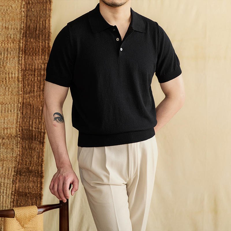 Sophisticated Men's black monochrome cotton-linen polo featuring a tonal button-front design and high-end ribbed finishes.