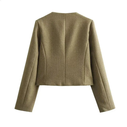 Back view of a brown cropped textured jacket with gold buttons in a structured boxy fit