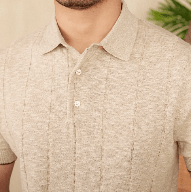 Close-up of the LORMIER vertical ribbed texture and three-button hardware, highlighting the premium knit quality.