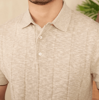 Close-up of the LORMIER vertical ribbed texture and three-button hardware, highlighting the premium knit quality.