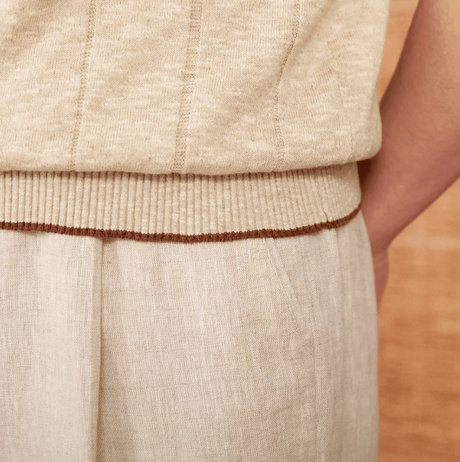 Sophisticated beige ribbed knit polo for men featuring a three-button front and breathable linen-cotton blend.