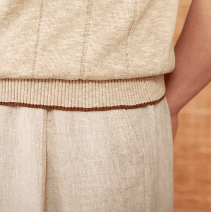Sophisticated beige ribbed knit polo for men featuring a three-button front and breathable linen-cotton blend.