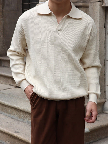 Men's ivory long sleeve buttonless V-neck polo featuring a relaxed fit and premium cotton-poly blend for a comfortable, cool look.