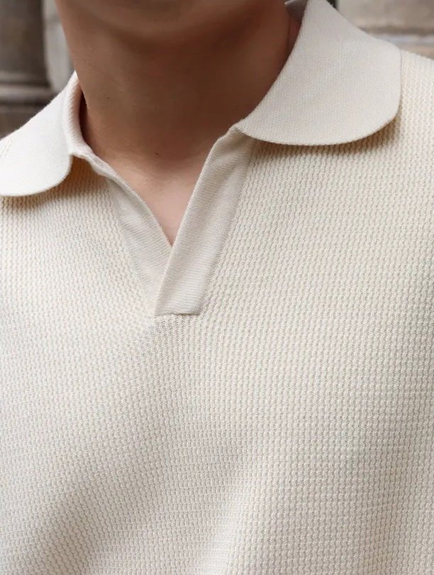 Men's ivory long sleeve buttonless V-neck polo featuring a relaxed fit and premium cotton-poly blend for a comfortable, cool look.