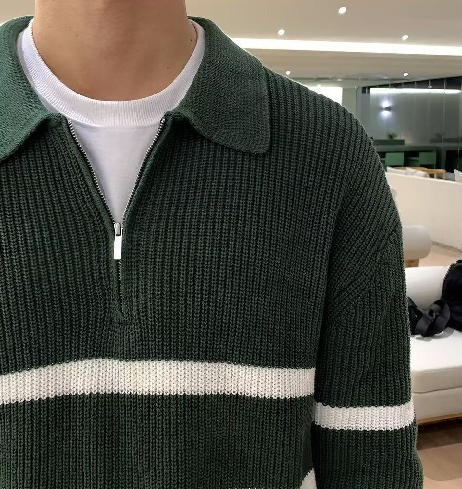 Men's green loose half-zip striped polo sweater with ivory contrast panels and a heavy-gauge ribbed cotton finish.