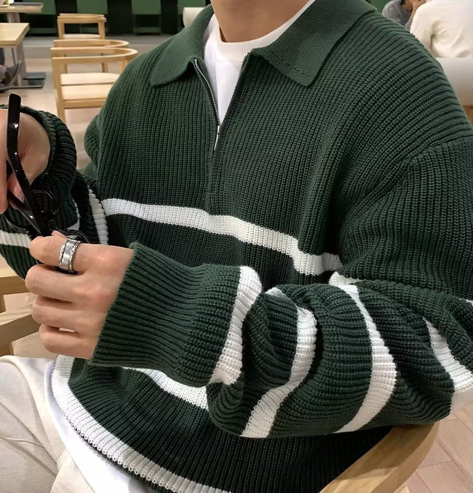 Men's green loose half-zip striped polo sweater with ivory contrast panels and a heavy-gauge ribbed cotton finish.