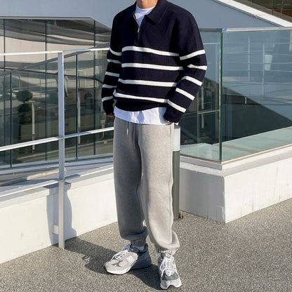 Navy blue loose half-zip striped polo sweater for men, showcasing a relaxed fit and premium vertical ribbed knit.