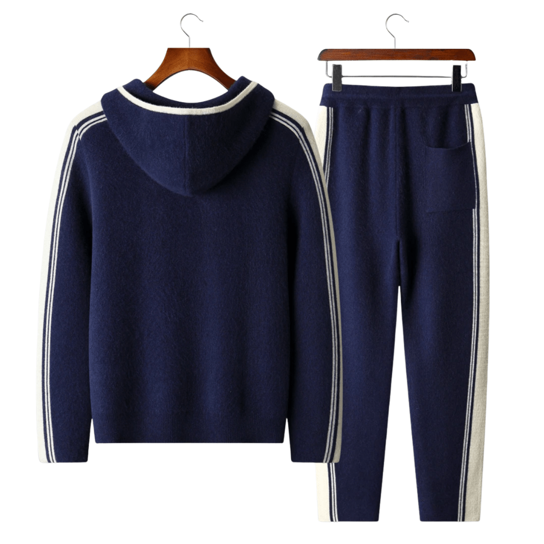 Men's navy blue 100% merino wool lounge set with ivory side stripes on the hoodie sleeves and jogger legs.