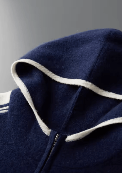 Interior view of the navy merino wool hood featuring a clean ivory knit lining along the edge.