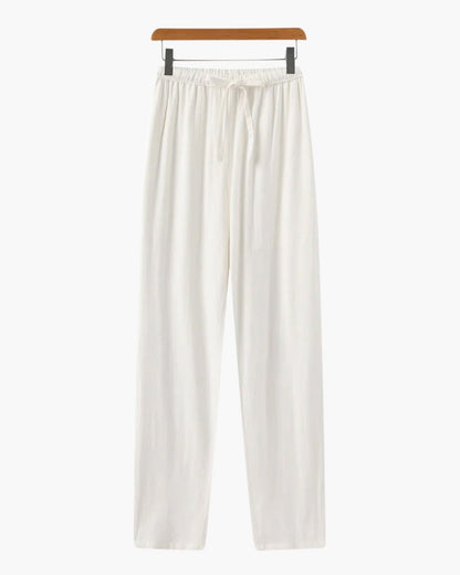 Premium Men's white straight linen trousers showcasing a crisp, breathable flax weave and a modern tailored fit.
