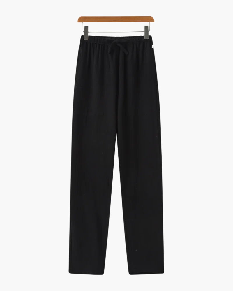 Sophisticated Men's black linen trousers featuring a minimalist straight-cut silhouette for versatile summer styling.