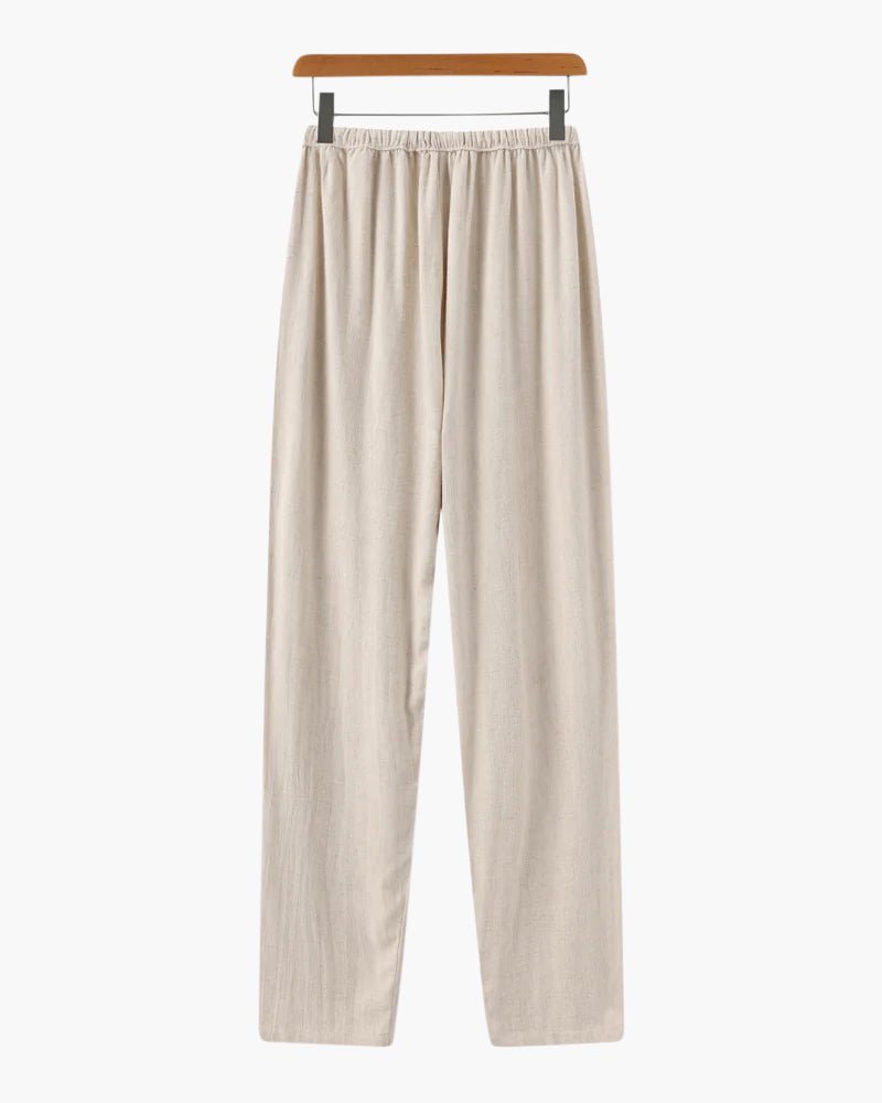 Men's beige straight-leg linen pants featuring a clean structured profile and an adjustable drawstring waistband.