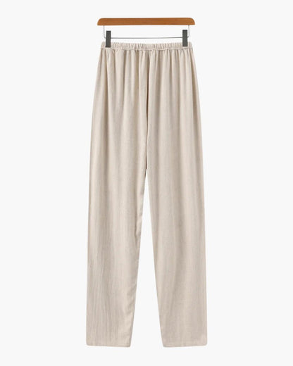 Men's beige straight-leg linen pants featuring a clean structured profile and an adjustable drawstring waistband.