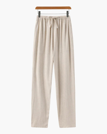 Men's beige straight-leg linen pants featuring a clean structured profile and an adjustable drawstring waistband.