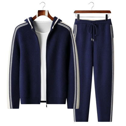 Men's navy blue 100% merino wool lounge set with ivory side stripes on the hoodie sleeves and jogger legs.