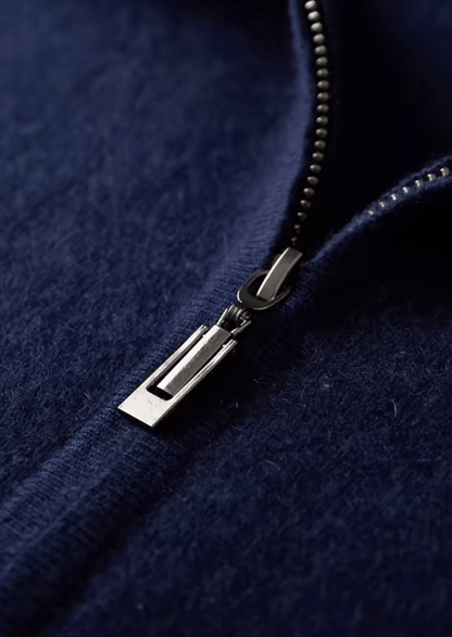 Close-up of the premium silver-tone rectangular zipper pull on the navy merino wool hoodie.