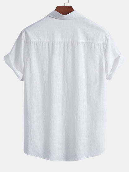 White shirt on a hanger against a white background