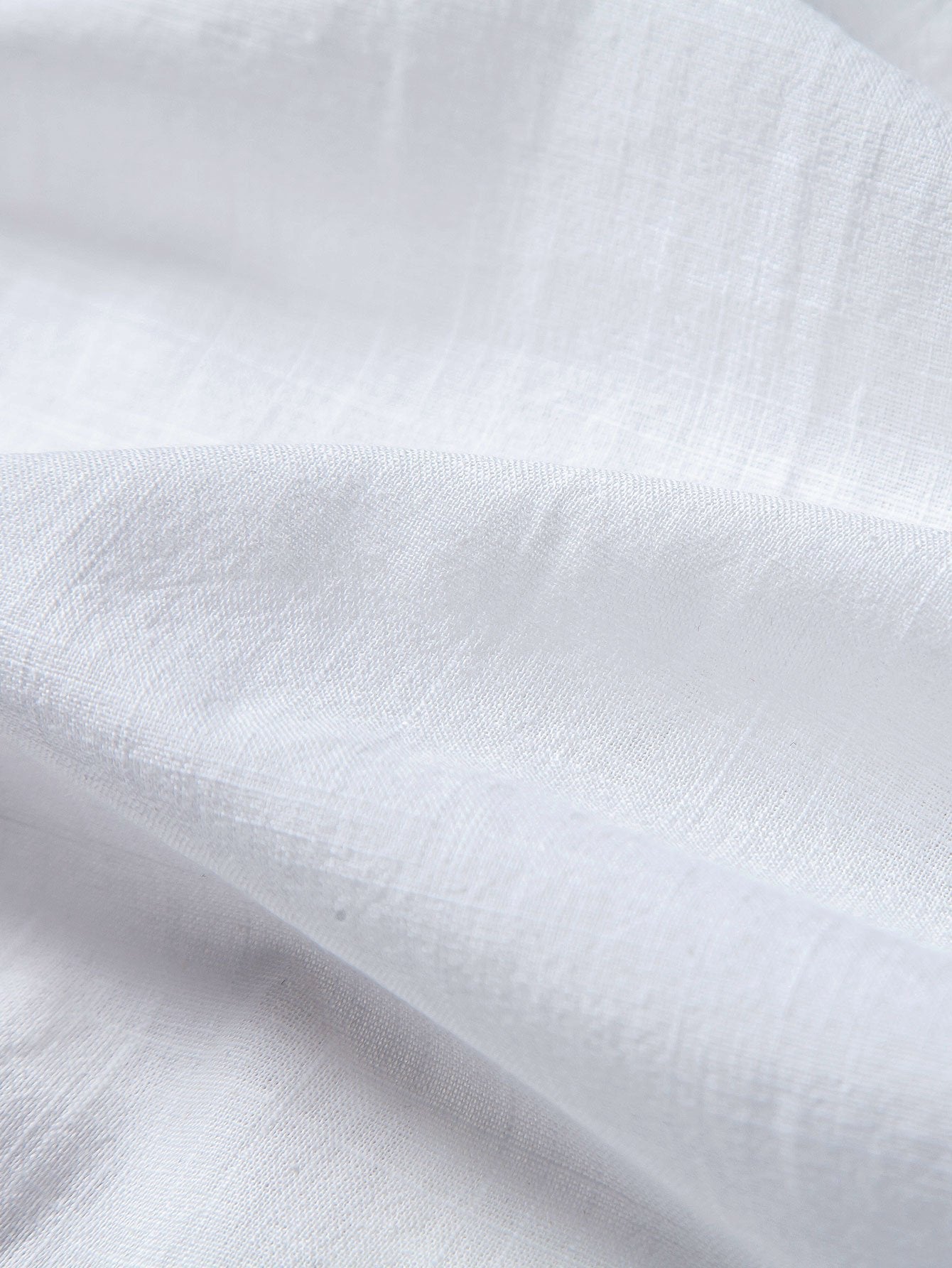 Close-up of white fabric with subtle texture
