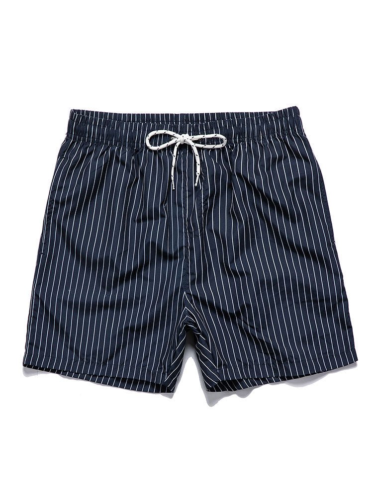 Navy blue shorts with white stripes on a white background
