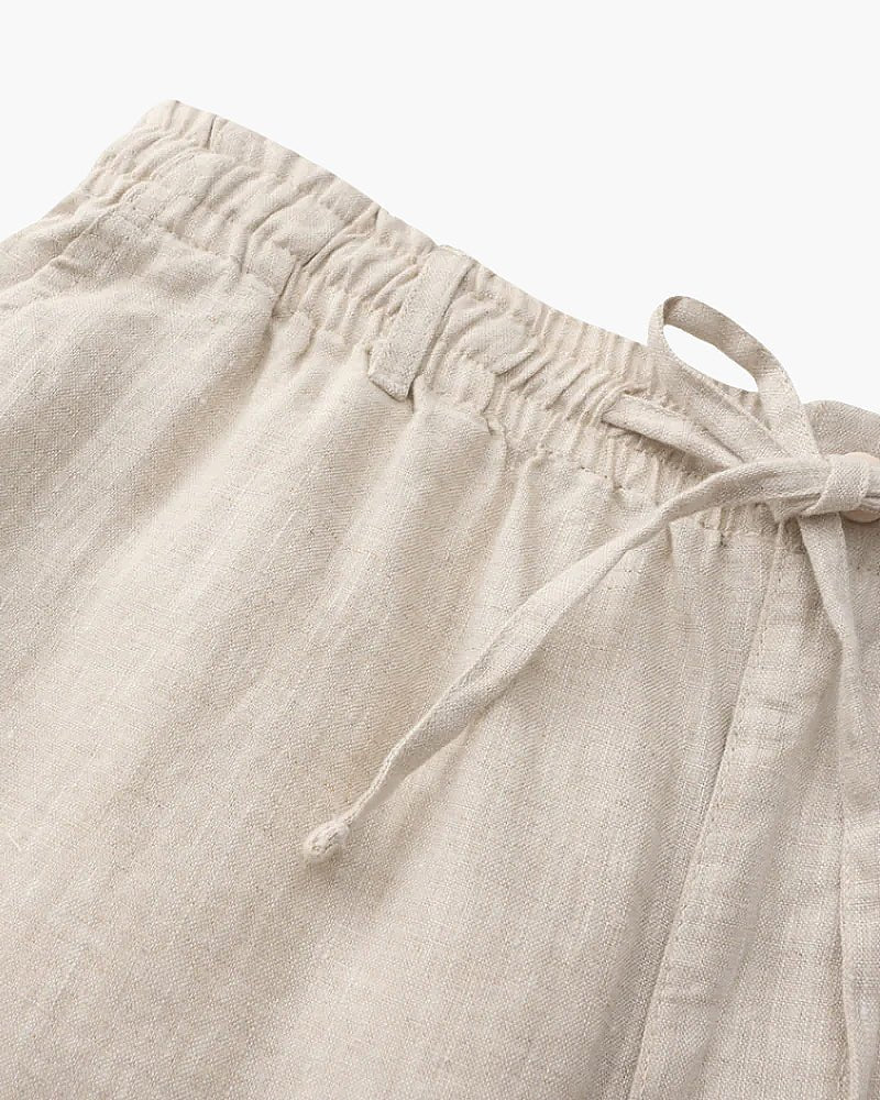 Men's beige 100% linen set featuring a short-sleeved button-down shirt and matching tailored shorts for a monochromatic Old Money look.