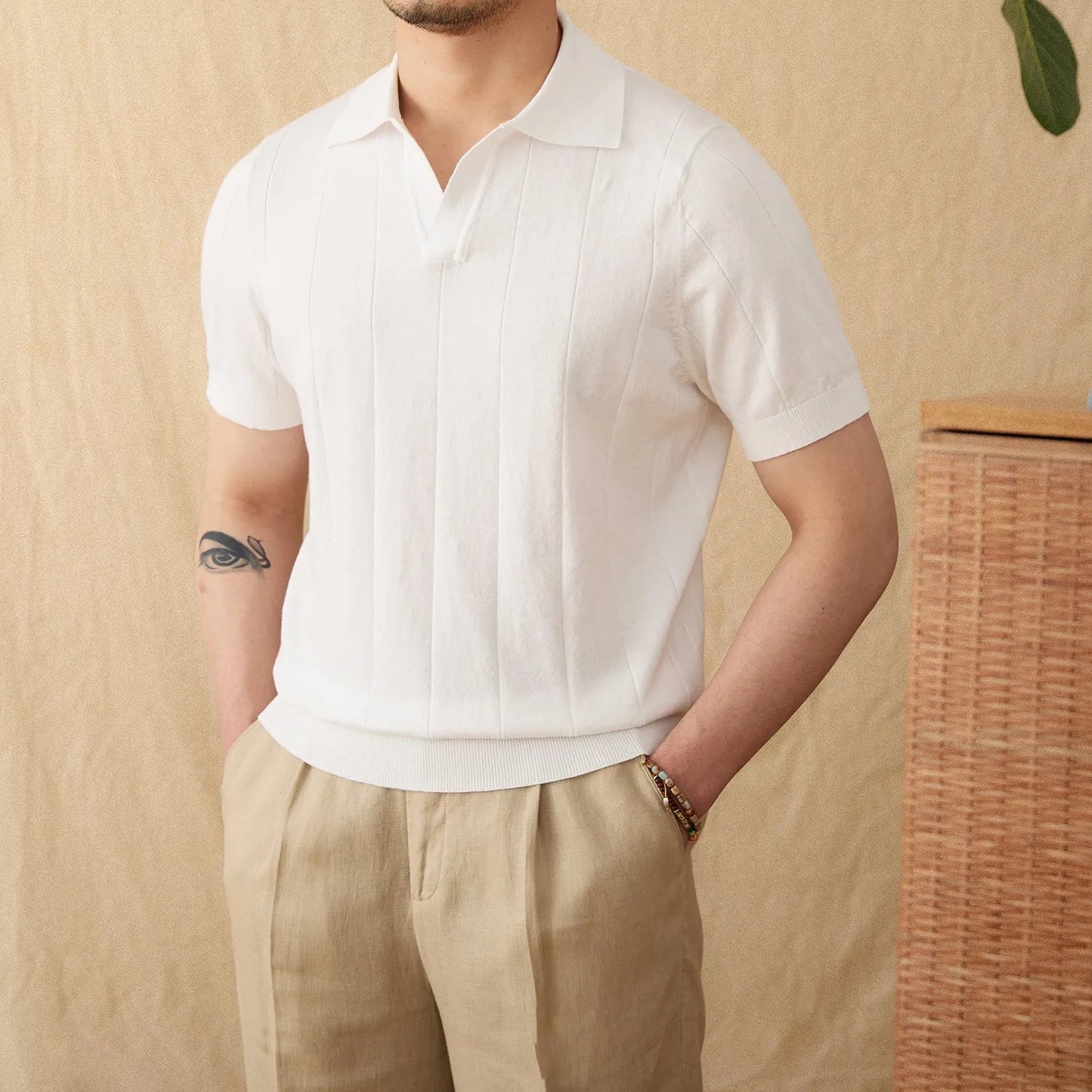 Men's white open collar polo featuring a sophisticated vertical ribbed texture and a breathable cotton-linen construction.